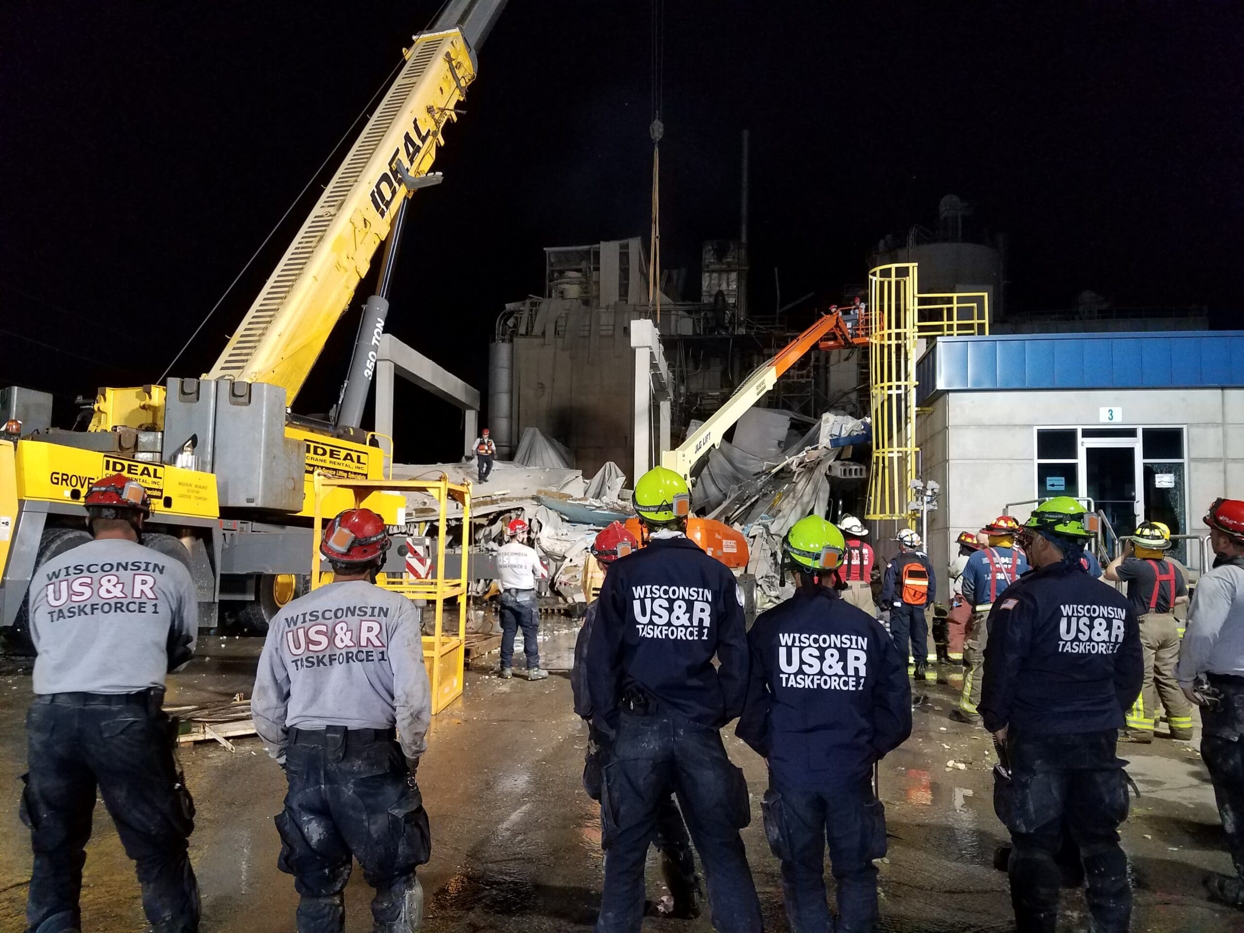 Wisconsin US & R Taskforce 1 on scene with large crains helping in rescue efforts