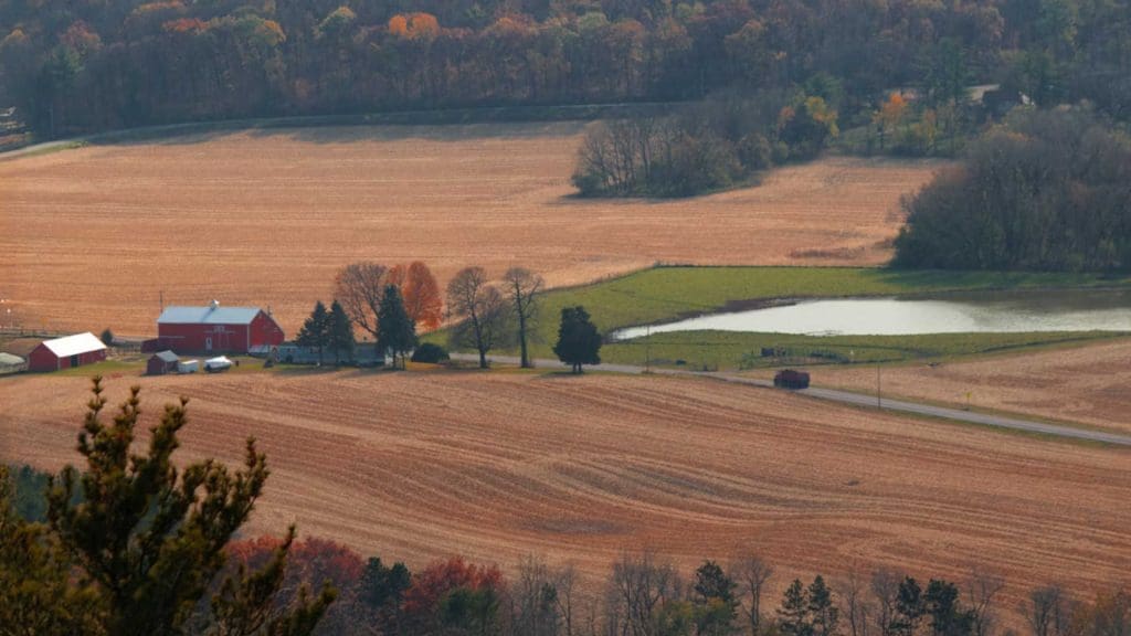 A farm in fall with it's field's picked and ready for winter