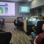 People working in the SEOC during the April storms of 2026