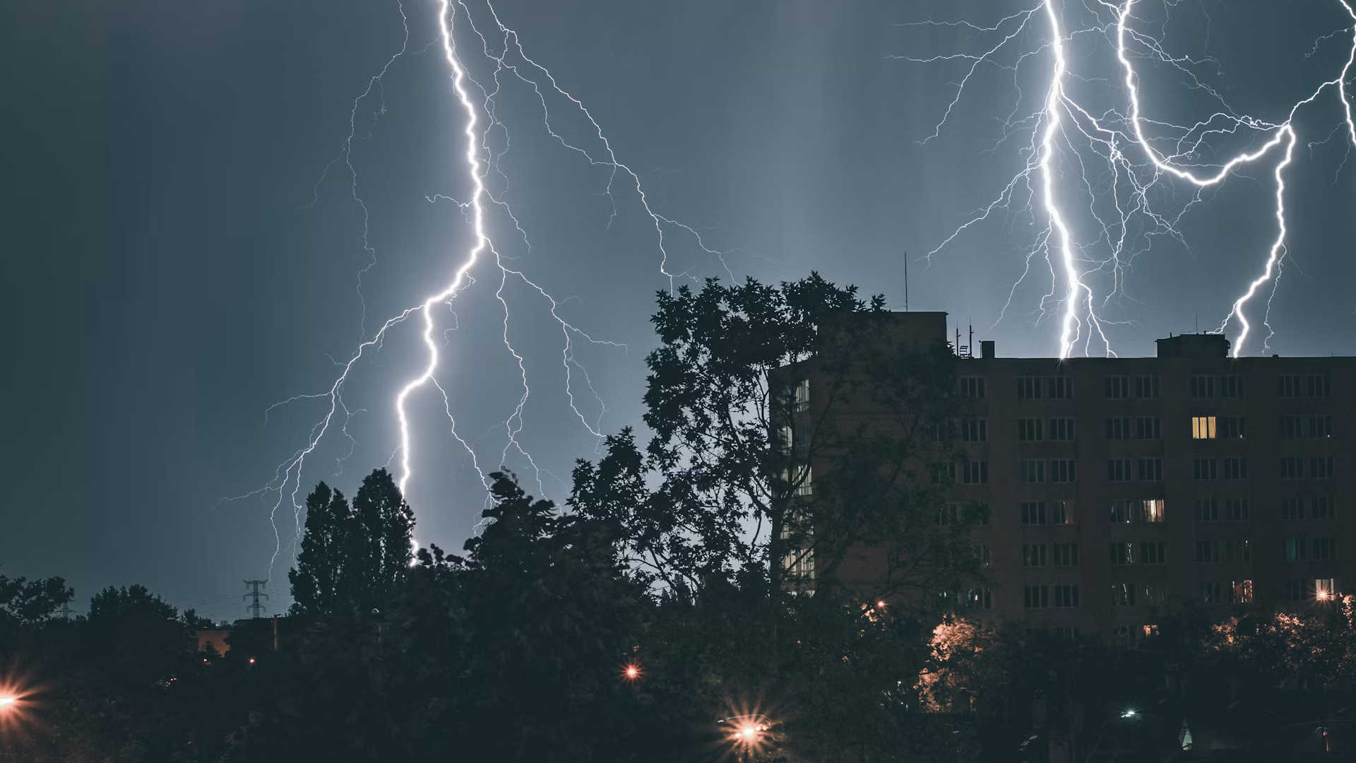 Lighting striking in a city at night