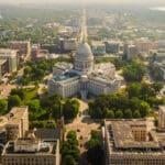 A photo of the Madison capital from the air looking down on the square.