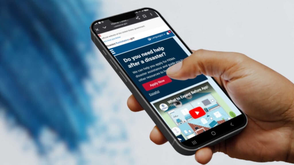 A phone with the disaster help FEMA page pulled up