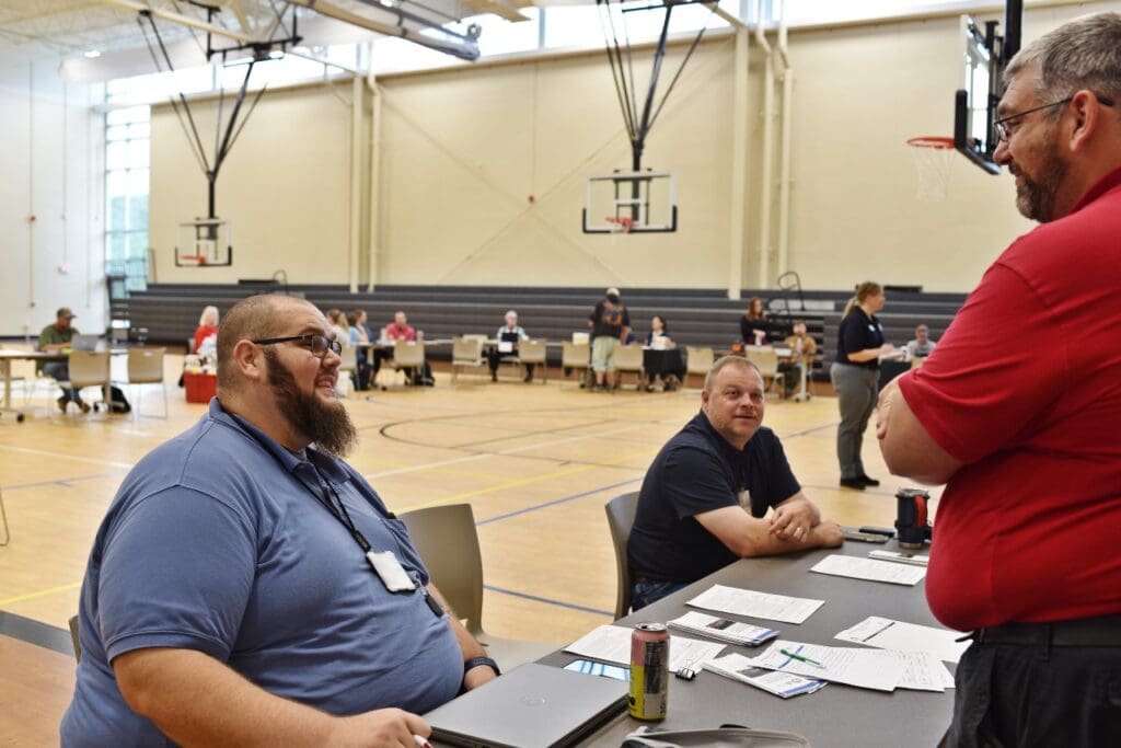 Jackson County Emergency Management Director Jack Workman speaks with an exercise player during the MARC portion of the recovery exercise