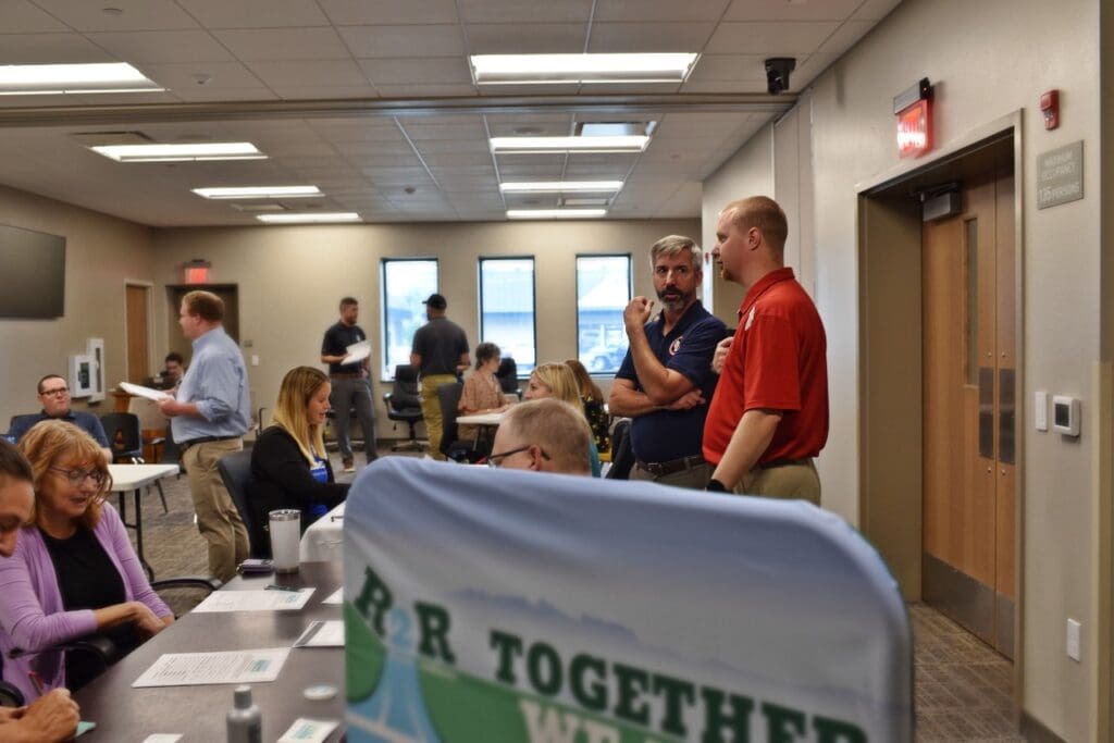 Vernon County Emergency Management Director Brandon Larson speaks with WEM Administrator Greg Engle during the MARC portion of the recovery exercise.