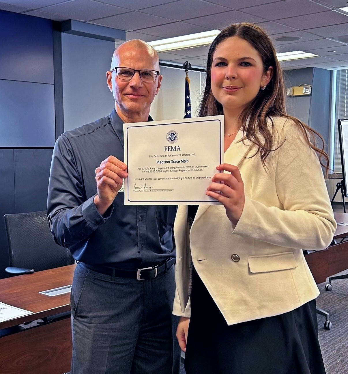 Madison Malo receives a certificate of achievement for her participation in the FEMA Region 5 Youth Preparedness Council. Courtesy: Madison Malo.