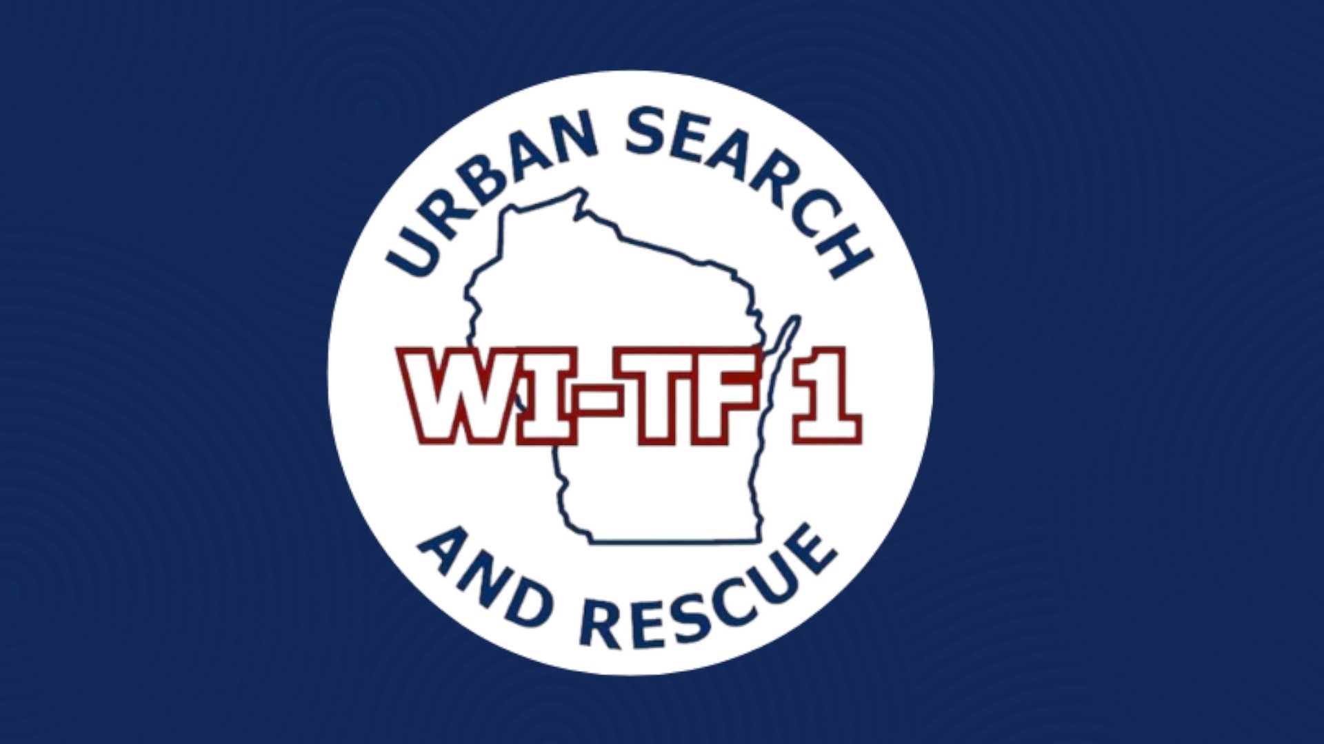 A blue background with the WI-TF1 Urban Search and Rescue logo on it.