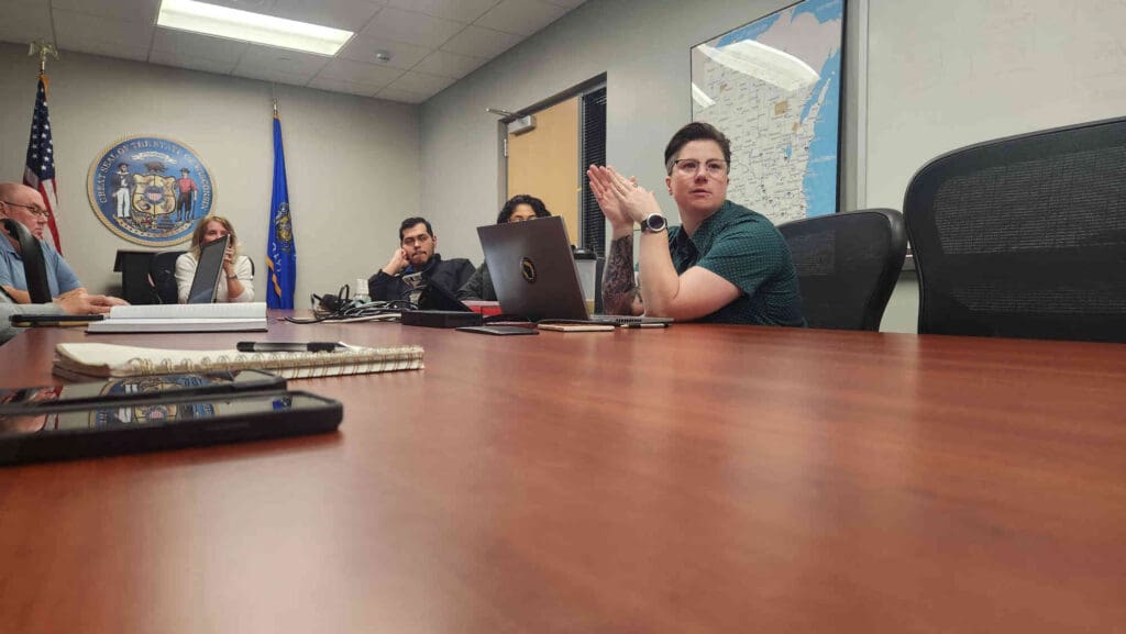 People in a meeting room discussing disaster recovery centers