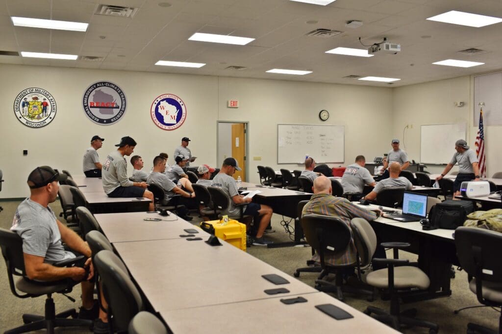 Members of WI-TF1 participated in a briefing prior to their deployment